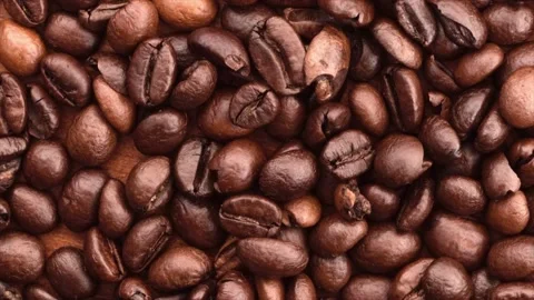 Heap of coffee beans rotating on the table Stock Footage 134594270