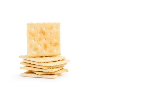A heap of cracker biscuits on a white background Stock Photos