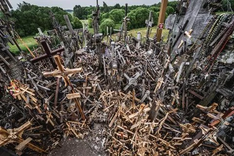 Heap of crosses on so called Hill of Crosses in Lithuania Stock Photos