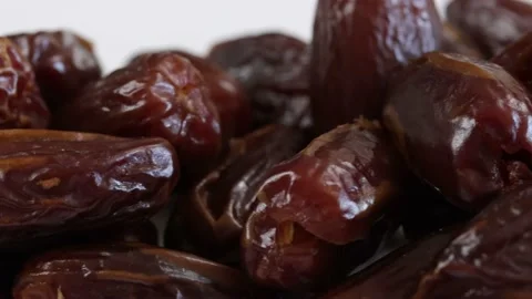 Heap of dates, close-up, isolated on a white background Stock Footage 236894365