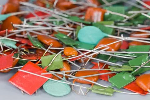 Heap of different fixed capacitors, close-up in selective focus Stock Photos