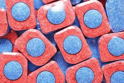 Heap of dishwasher detergent tablets background. Stock Photos