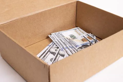 Heap of dollars in box on white background 库存照片