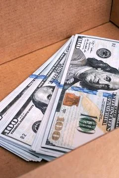 Heap of dollars in box on white background 库存照片