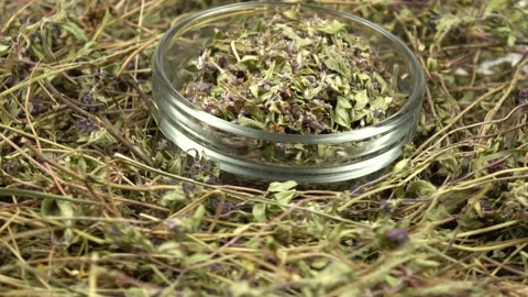 Heap of the dried herb thyme and glass jar with peeled thyme, background Stock Footage 278038090