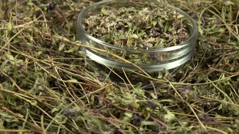 Heap of the dried herb thyme and glass jar with peeled thyme Stock Footage 278038144