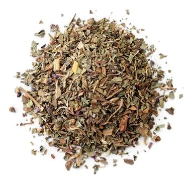 Heap of dry basil close-up on a white, isolated. The view from top Stock Photos