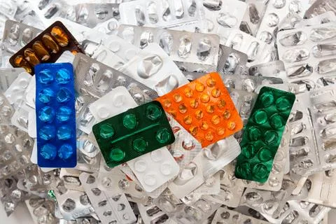 Heap of empty assorted various medicine tablets pills blisters different colo Foto stock