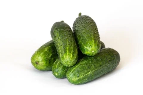Heap of five fresh cucumbers on white background Stock Photos