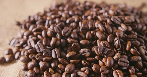 Heap Of Fresh Roasted Coffee Beans On Hessian Sack 4K Stock Footage 86084900