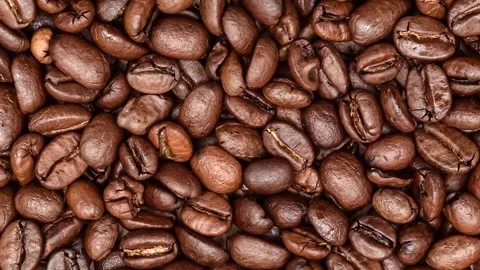 Heap of fresh roasted coffee beans spinning with zoom out Stock Footage 270038619