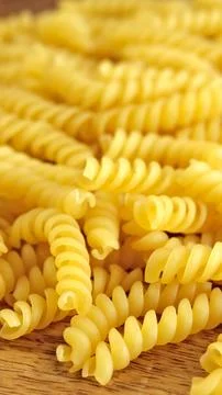 Heap of fusilli pasta, close-up, on a table 스톡 사진
