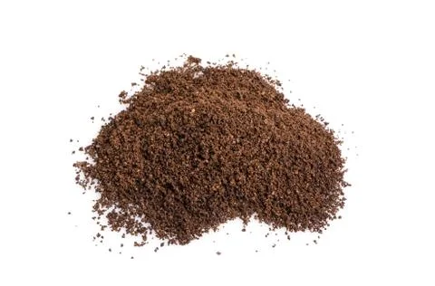 Heap of grained coffee beans placed on white background. Stock Photos
