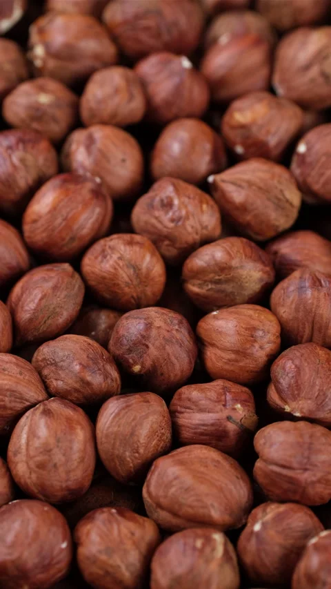 Heap of hazelnuts close up, rotation Stock Footage 277479266