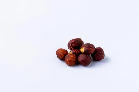 Heap of hazelnuts on white background. Stock Photos