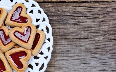 Heap of heart cookies in a plate on table Stock Photos