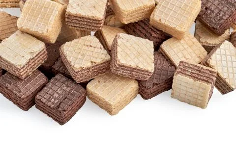 Heap of mixed square wafer biscuits isolated on white background. Stock Photos