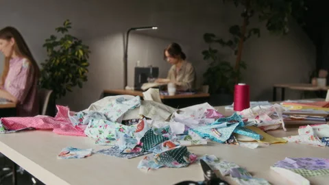 Heap of Multicolored Cloth Scraps on Cutting Table in Sewing Studio Video stock 315760917