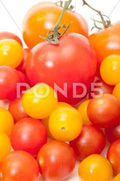 Heap multicolored ripe fresh cherry tomatoes Stock Photos