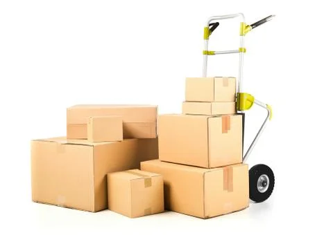 Heap or stack of brown carton transport boxes with barrow over white, deliver 写真素材