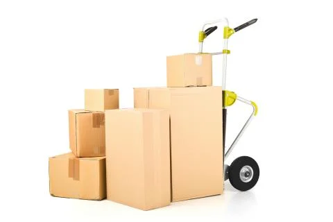 Heap or stack of brown carton transport boxes with barrow over white, deliver Foto stock
