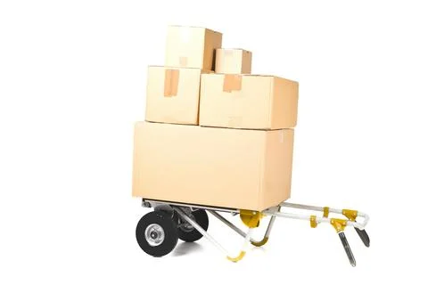 Heap or stack of brown carton transport boxes with barrow over white, deliver 写真素材