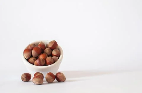 Heap or stack of full hazelnuts and copy space on right. Healthy vegan food. Stock Photos