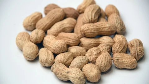 Heap of organic peanuts on white background Stock Footage 113072100
