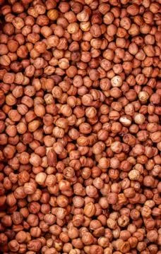 Heap of peeled hazelnuts without shell for background texture, close-up, top  写真素材