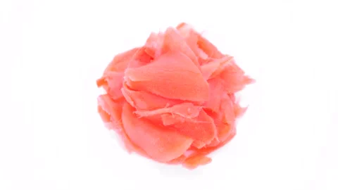 Heap of Pickled ginger slices on white plate, rotation Video stock 229967135