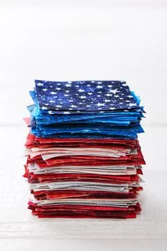 Heap of pieces of patchwork fabrics ordered like USA flag 库存照片