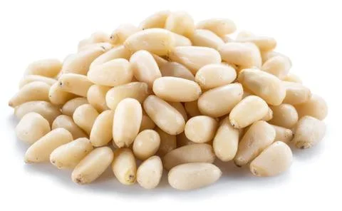 Heap of pine nuts on a white background Stock Photos