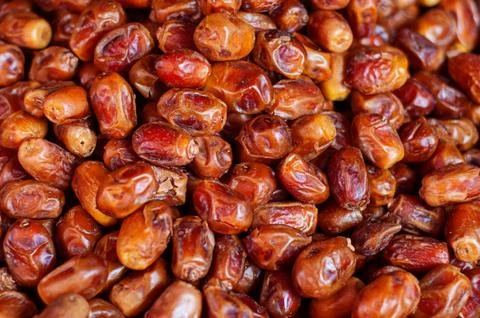 Heap of pitted dates isolated as background, top view Stock Photos