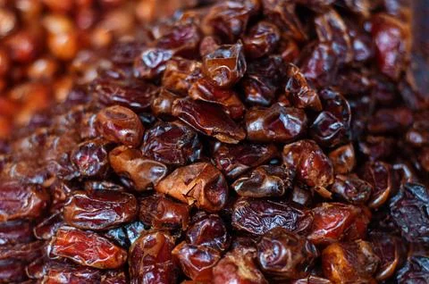 Heap of pitted dates isolated as background, top view Stock Photos