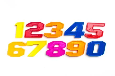 Heap of plastic colored arithmetic numbers close up. Stock Photos