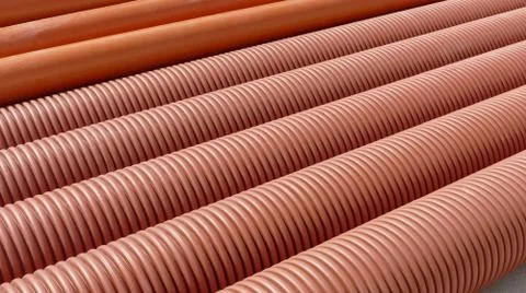 Heap of plastic ribbed tubes 库存照片