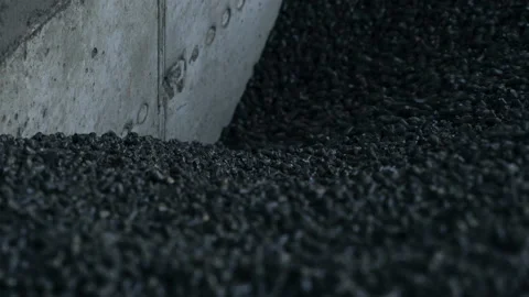 Heap of pressed charcoal moving downward into the furnace.  Stock-Footage 166380977
