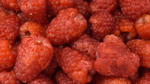 Heap of raspberries rotate as background Stock Footage 136360552