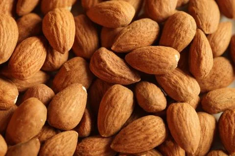 Heap of raw almonds nuts Stock Photos