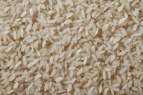 Heap of raw rice Stock Photos