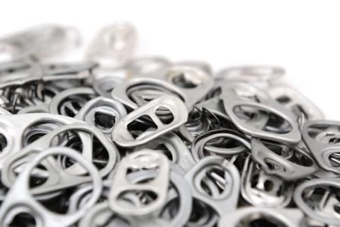 Heap of ring pulls with one pull tab in focus Stock Photos