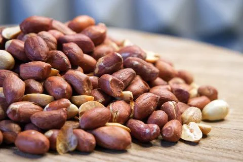 Heap of roasted peanuts, side view. Peanuts macro. Spanish Peanuts in pile Stock Photos