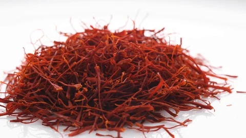 Heap of saffron threads, autumn crocus, isolated on white. Sideways movement. Stock Footage 128676213