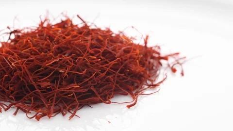 Heap saffron threads, autumn crocus turntable  on white. Sideways movement. 動画素材 128676221