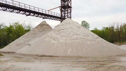 Heap of sand at a sand extraction heavy machinery equipment, mine industry - Stock Footage 155069733