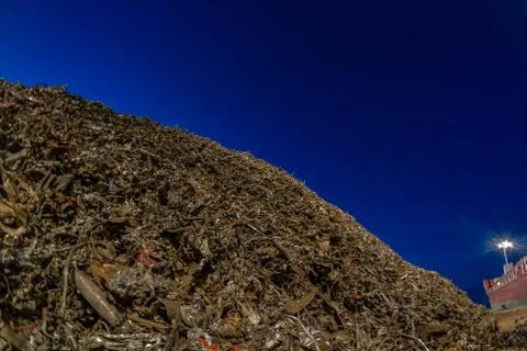 Heap of scrap metal stored for loading on the ship Stock Photos