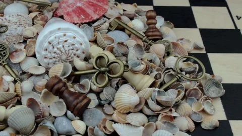 Heap of shells, chess and keys Stock Footage 81263407
