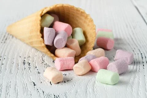 Heap of small colored marshmallow on table Stock Photos