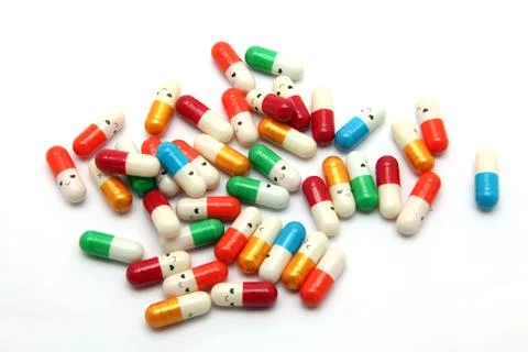 Heap of smiling capsule Stock Photos