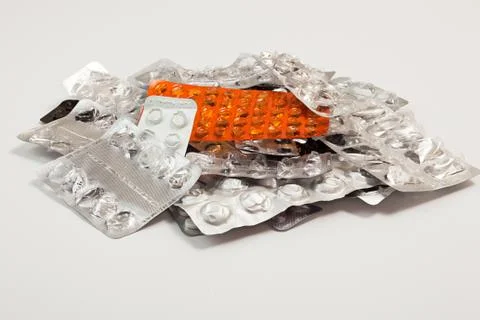Heap stack of empty blisters of medicine tablets and pills on white backgroun Stock-Fotos